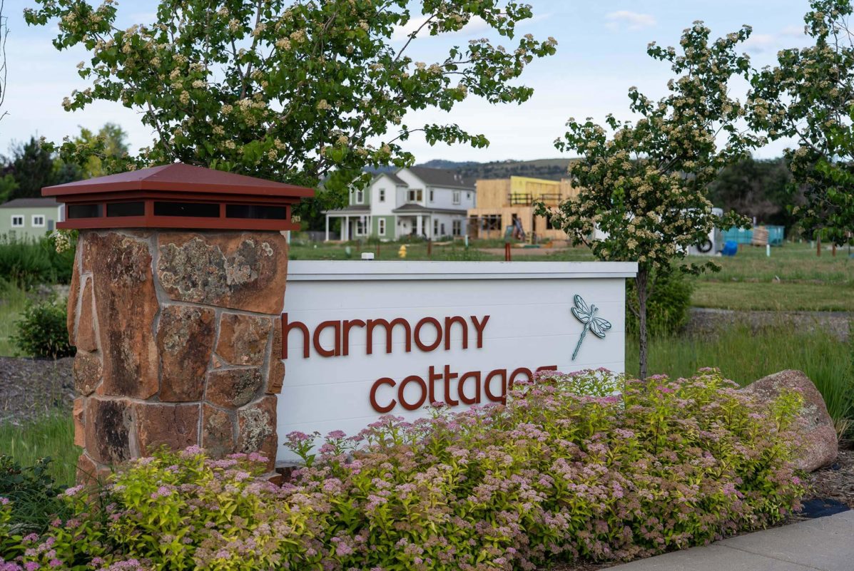 Signage for the entrance of Harmony Cottages an affordable single-family housing community for Habitat for Humanity in Fort Collins, CO
