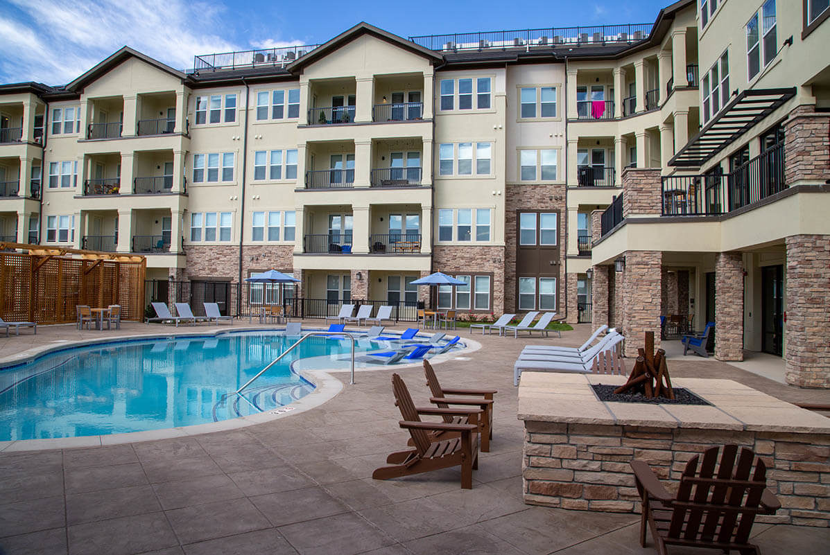 Rise Luxury Apartments image of pool and building Johnstown, CO